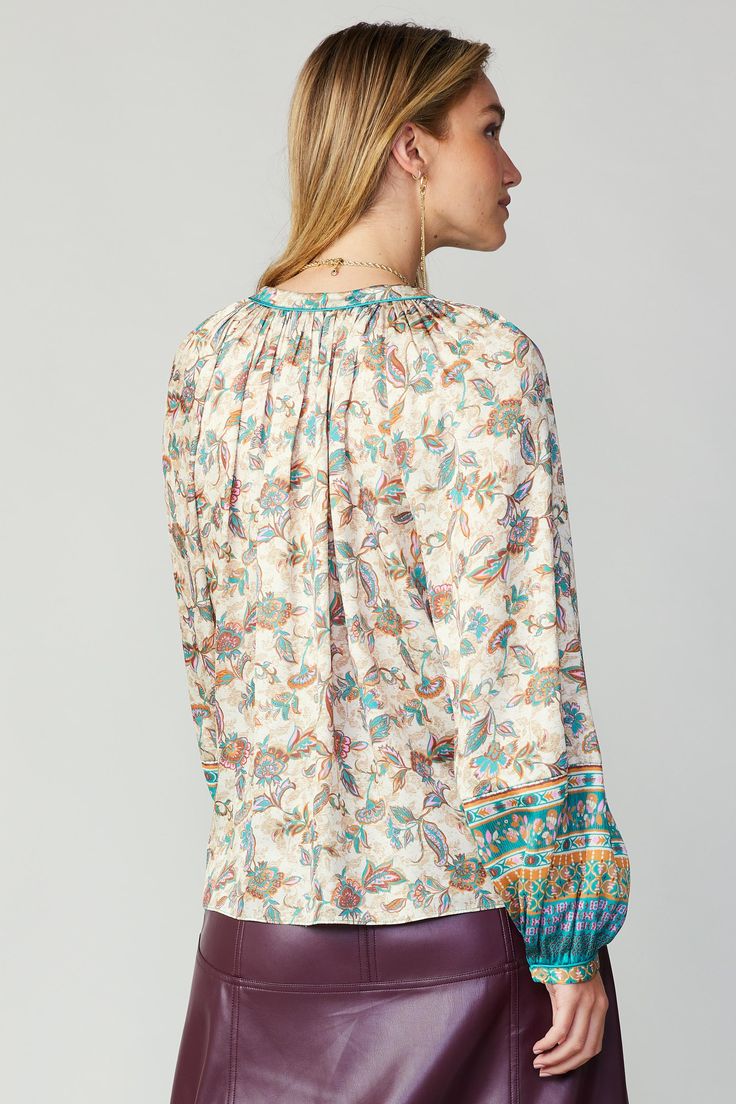 Switch up your look this season with a loose, flowy top in a duet of prints. This one comes in a pretty floral contrasted by an intricate border pattern and pale pink piping. With a split neckline and self-tie detail, it's the perfect way to refresh your wardrobe. •Split neckline with self-tie •Contrast piping •Long sleeves •Slim cuffs with button closure •Relaxed fit Item number 2230053-3 100% Polyester Leather Midi Skirt, Border Pattern, Contrast Piping, Flowy Top, Border Print, Flowy Tops, Pink Blouse, Print Blouse, Printed Blouse