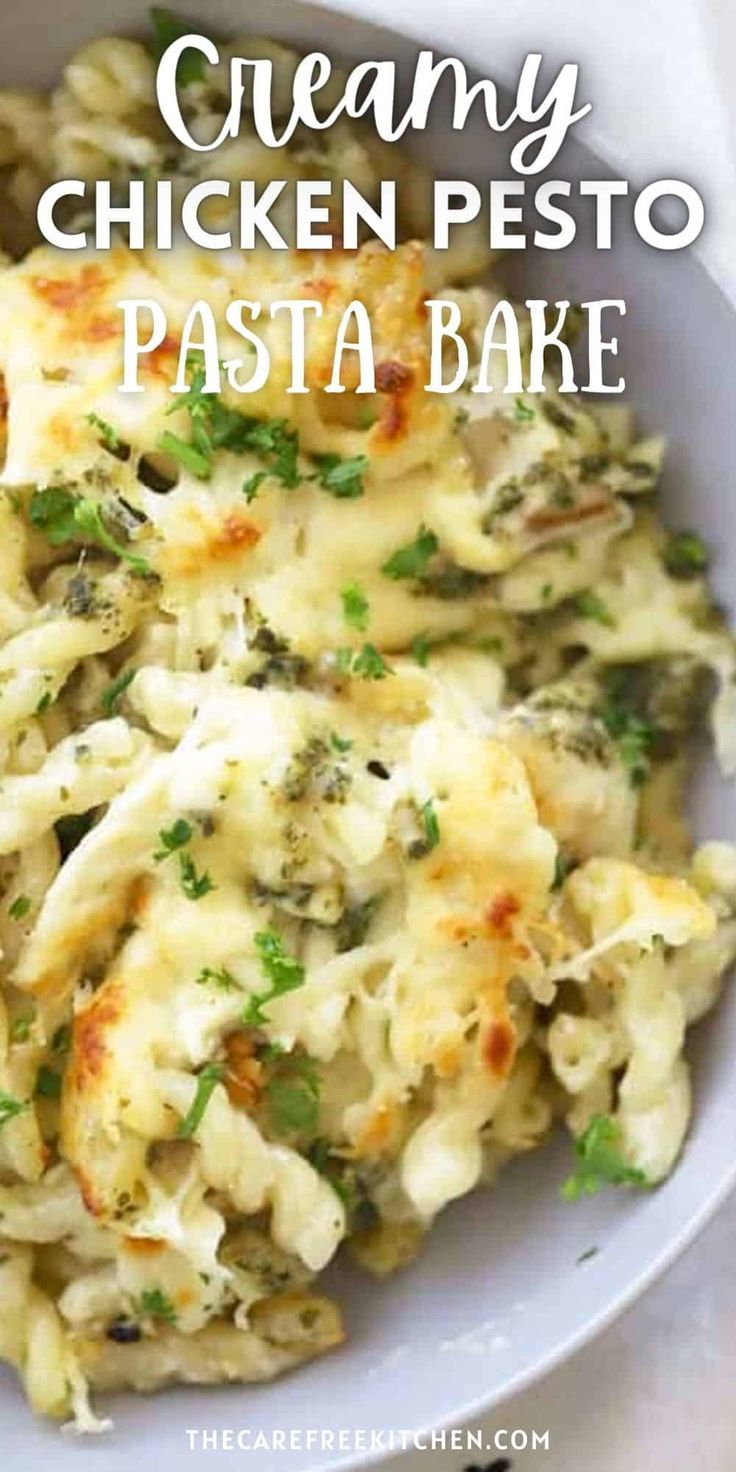 creamy chicken pesto pasta bake in a white bowl with the title above it