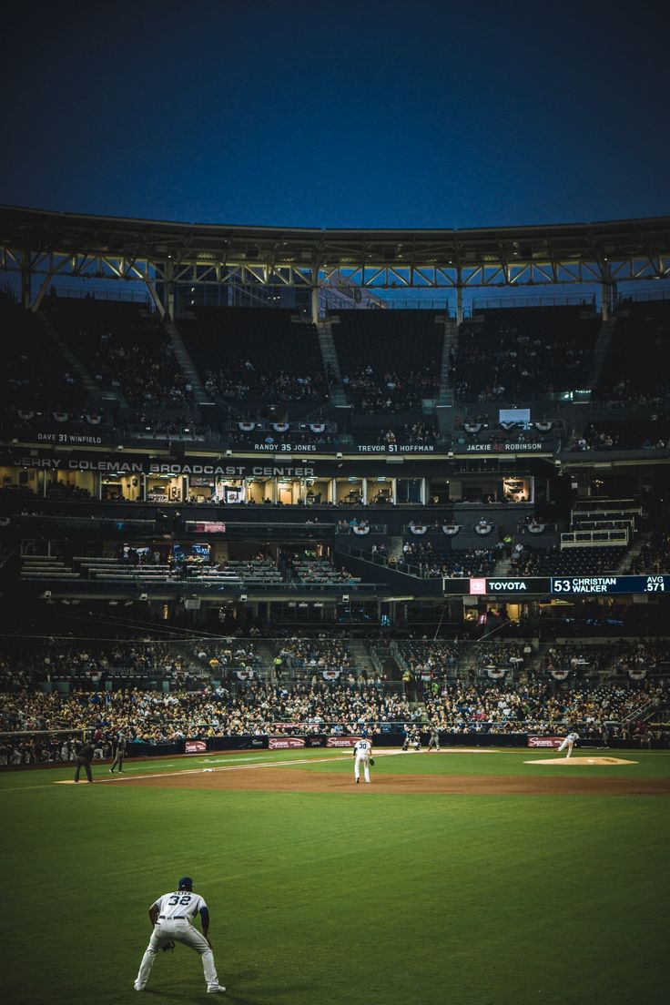 a baseball player standing on top of a field