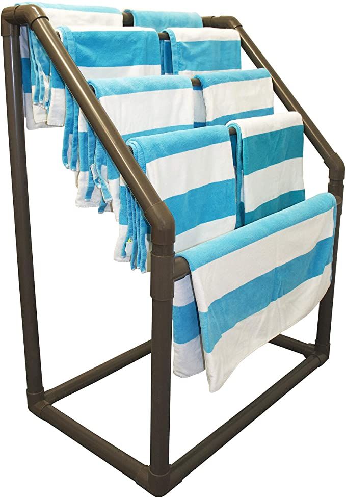 four towels are hanging in a rack on the clothes line, with blue and white stripes