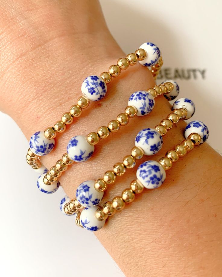 Blue Floral gold beaded bracelet Dainty Adjustable Gold Beaded Bracelets, Adjustable Beaded Gold Bracelet, Gold Friendship Bracelets With Gold Beads, Adjustable Gold Bead Bracelet, Gold Beaded Bracelet As Gift, Gold Wrap Bracelet With Colorful Beads As Gift, Gold Beaded Bangle Friendship Bracelet, Gold Beaded Chain Bracelet As Gift, Gold Bracelet With Beaded Chain For Gift