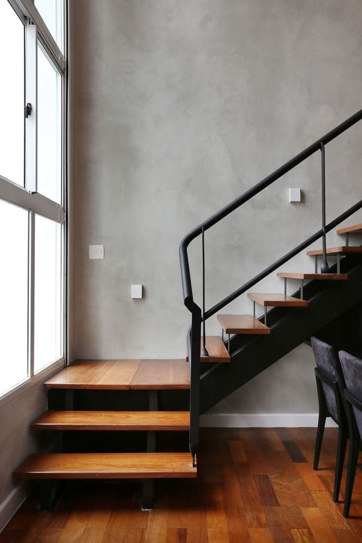 there is a set of stairs leading up to the second floor in this modern home