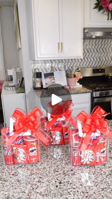 the kitchen counter is covered with candy and wrapped in red ribbon bows, as well as small packages of candies