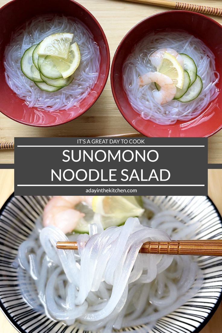 two red bowls filled with noodles and cucumbers on top of a wooden table