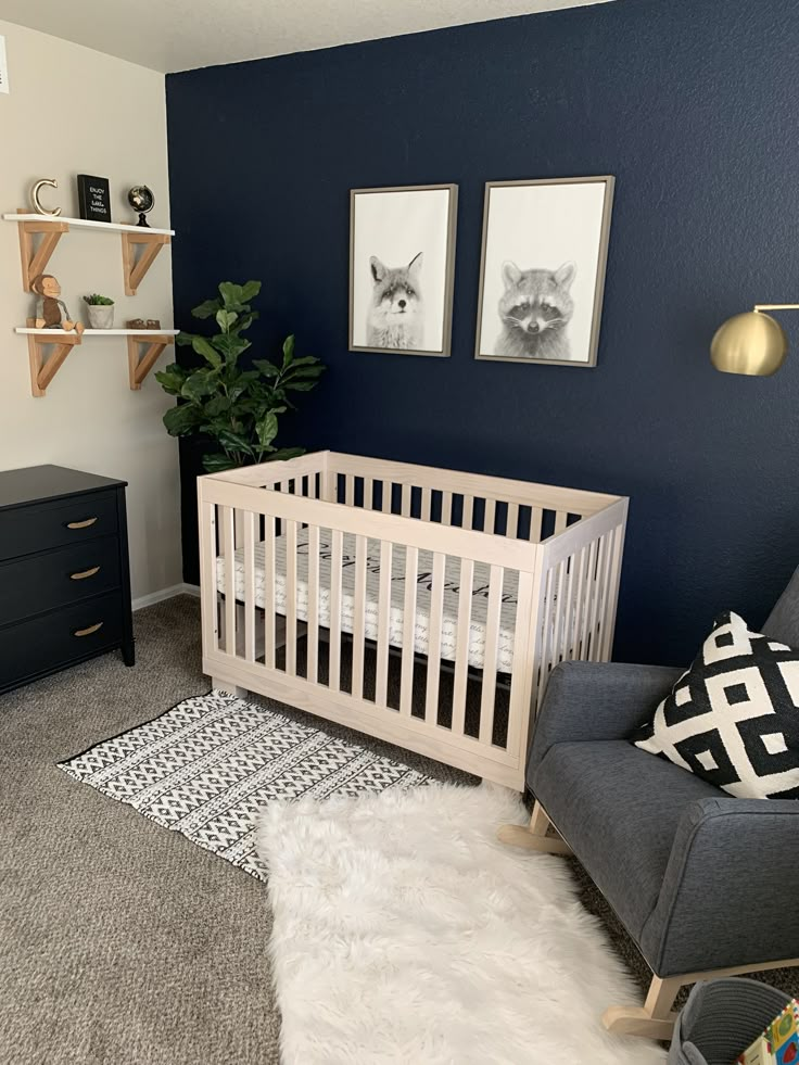 a baby's room with blue walls and white carpet