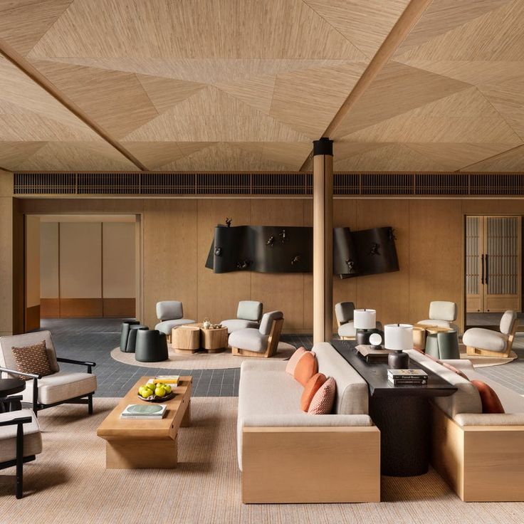 a living room filled with lots of furniture next to a wooden ceiling mounted flat screen tv