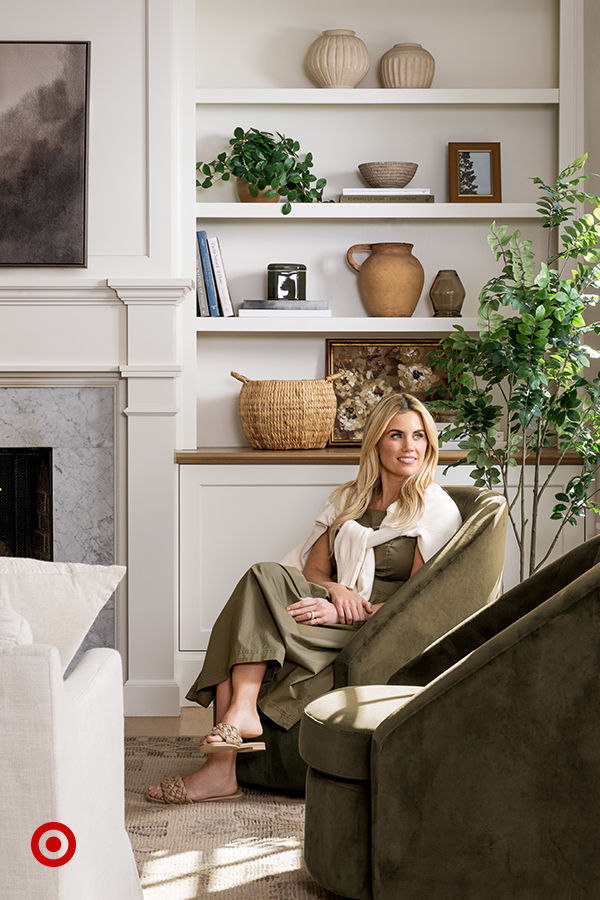 a woman sitting on a chair in a living room