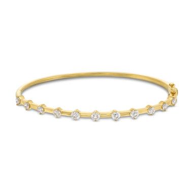 This Diamond Station Bangle Bracelet by Heera Moti showcases a total carat weight of 1.30 brilliant round diamonds. Gold Bracelet With Single Cut Diamonds, Diamond Bracelets With Single Cut Diamonds, Diamond Bangle Bracelet With 17 Jewels, Round Bracelets With Single Cut Diamonds, Diamond Bangle Gold Bracelet With Brilliant Cut, Gold Diamond Bangle Bracelet With Brilliant Cut, Dazzling Single Cut Diamond Bangle Bracelet, Diamonds Direct, Fine Jewelry Designers