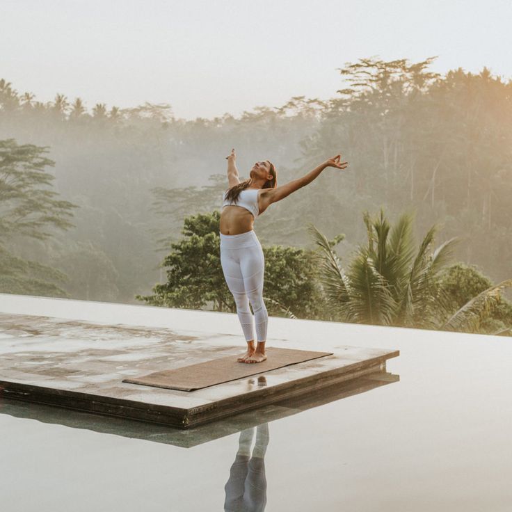 a woman standing on top of a wooden platform