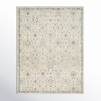 a white rug with floral designs on it