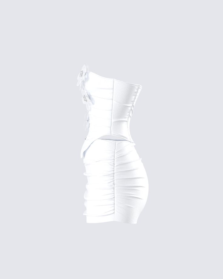 Angel energy only 🤍 This heavenly two-piece set featuring a white flower corset top paired with a matching mini skirt will bring everyone to their knees in admiration 😇 White Ruched Corset Dress For Party, Fitted White Two-piece Set, White Mini Length Corset With Corset Back, White Corset For Spring Party, White Ruched Flirty Corset Dress, White Ruched Corset Dress With Flirty Style, White Ruched Corset Dress In Flirty Style, White Ruched Corset Dress Flirty Style, White Flirty Corset Dress For Night Out