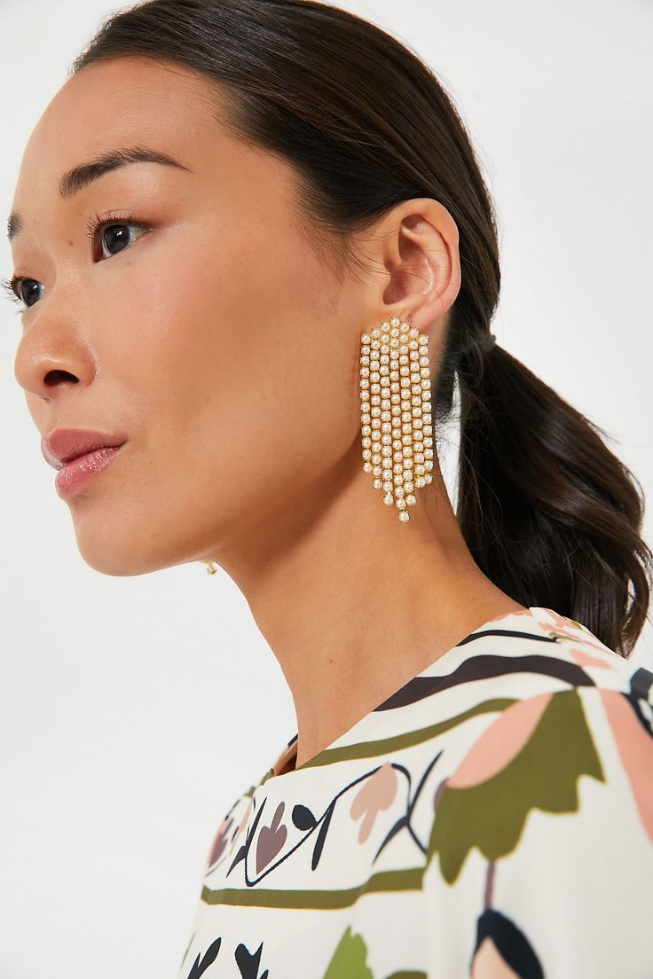 Pile on the sophistication and glam with the Pearl Simone Earrings. These stunners feature several strands of faux pearls that will move with you as you dance the night away. Wear these stunners to date night, girls dinner, or any social soiree on your calendar for added glitz!
Dangle silhouette
Post back closure
Material: Gold plated brass, Faux pearls 
Care: Keep jewelry away from water and chemicals; remove during physical activities; store separately in a soft pouch Shoulder Duster Earrings, Long Drop Earrings, Crystal Drop Earrings, Keep Jewelry, Rhinestone Earrings, Chain Earrings, Bridal Earrings, Jewelry Bags, Crystal Jewelry