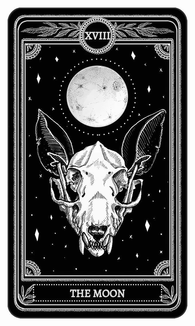 the moon tarot card with an animal's head and two bats on it