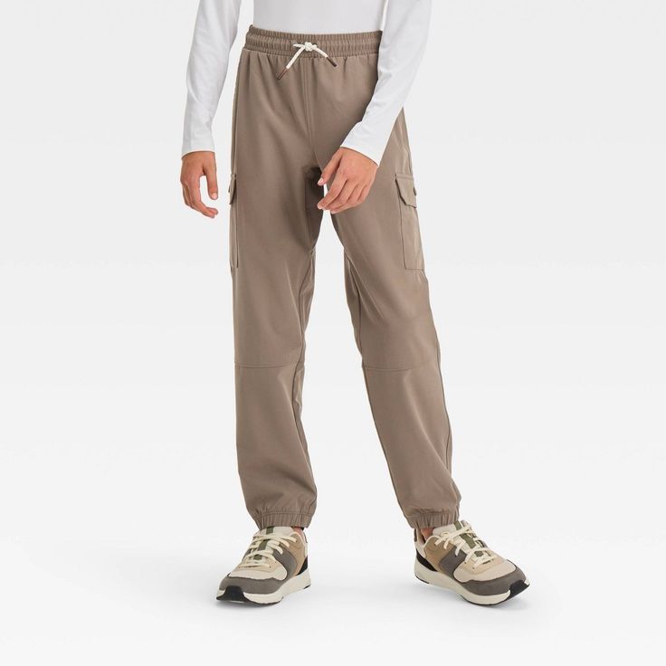 Why we're ALL IN: Water-repellent finish is specially designed to help keep them fresh and cool through a range of activities. Flap pockets let them keep on-the-go essentials close by while a full waistband elastic with front drawcord makes for a stay-put fit. Designed in a mid rise, these adventure pants help keep them shielded from the sun with the UPF 50+ rated construction. All in Motion™: Made for every move, priced for every day. Relaxed Fit Cargo Pants For Outdoor Sportswear, Solid Color Activewear With Side Pockets For Outdoor, Outdoor Solid Activewear With Side Pockets, Functional Solid Cargo Pants For Sports, Outdoor Sportswear Pants With Elastic Waistband, Sportswear Bottoms With Functional Pockets For Outdoor Activities, Outdoor Activewear With Pockets, Solid Activewear With Pockets For Outdoor, Moisture-wicking Cargo Pants For Outdoor Activities