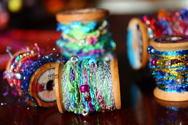 three spools of bead are sitting next to each other on a table