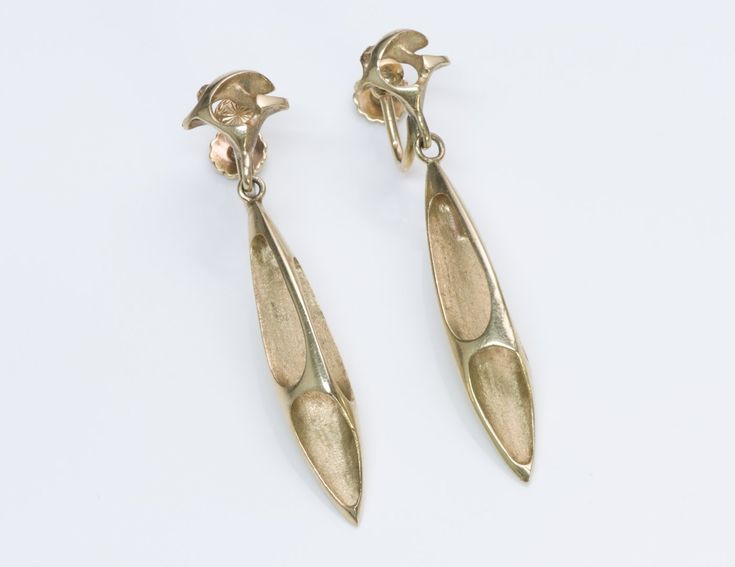 Vintage Ed Wiener Gold Earrings Abstract modernist dangling 14k yellow gold pierced earrings created by Ed Wiener of New York. Approximate Measurements: Length 2", Width 0.3" Weight: 10 Grams 14k Gold Linear Earrings For Evening, Modern Brass Linear Earrings For Formal Events, Contemporary Polished Earrings For Evening, Modern Brass Earrings For Evening, Modern Brass Linear Earrings For Formal Occasions, Art Deco Yellow Gold Earrings For Evening, Modern Long Drop Earrings For Formal Occasions, Modern Formal Clip-on Hallmarked Earrings, Contemporary Jewelry With Matching Earrings For Formal Events