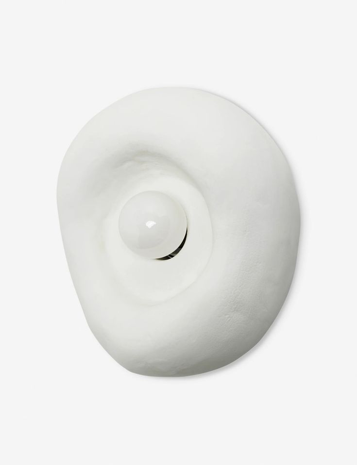 a white object that looks like it is spinning in the air with its head turned upside down