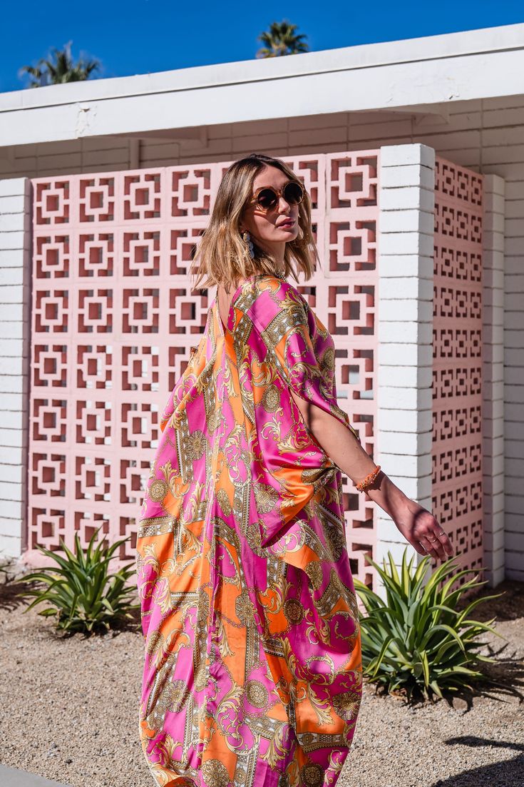 This colorful caftan is the answer to glam layering.. This exquisite garment is more than just a piece of clothing; it's a celebration of fabric in all its glory. Crafted with generous amounts of a ultralight satin rayon and lots of love, this piece offers an airy fit designed to drape beautifully on all body types. Bohemian splendor, handmade in California. Our caftans are a voluminous one-size fits all garment, approximately 50" in length. The intention of this shape is to celebrate the magic Pink Maxi-length Kaftan For Festivals, Festive Pink Floor-length Kaftan, Luxury Pink Printed Kaftan, Pink Summer Maxi-length Kaftan, Pink Embroidered Maxi-length Kaftan, Loungewear Dress, Plus Sized, Versatile Wardrobe, Caftan Dress