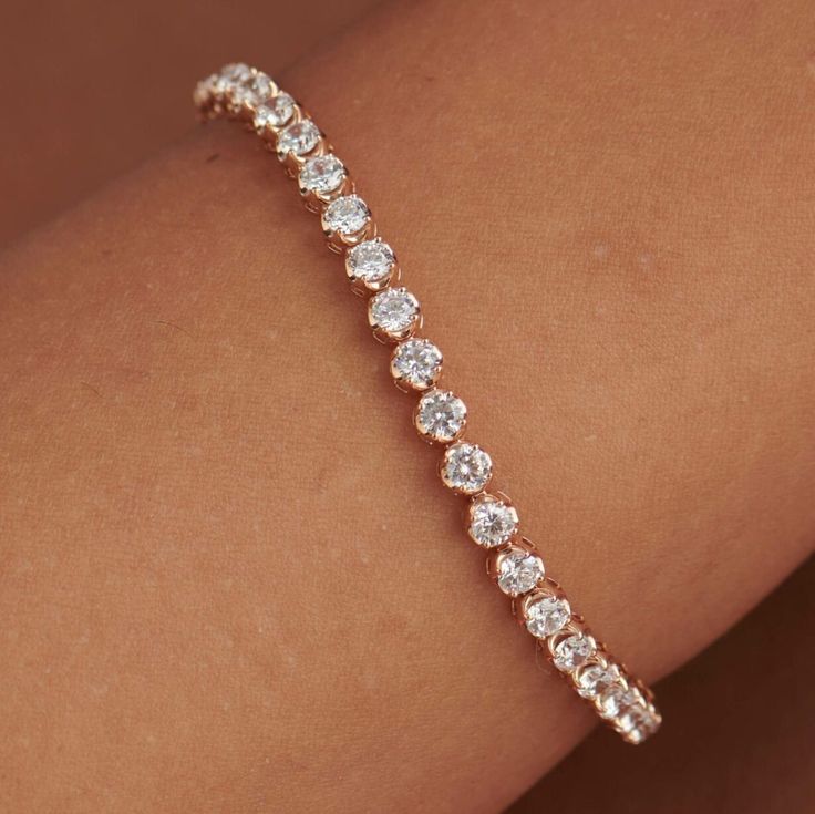 "14k Handcrafted Classic Tennis Close-Set Genious Diamond Bracelet Gold Dainty Bracelet Minimalist Bracelet Everyday Gift For Mom Solid Gold Jewelry                           Bracelet Style: The \"TENNIS BRACELET\" is Rose Cut Moissanite Diamond women's engagement Bracelet Many other center stone options are available upon request.   Center Stone:  Natural Old Europe Diamond  Materials: 14K Gold Engagement Tennis Bracelet Featuring a Round Shape Rose Cut Diamond  Customizable: Because each Bracelet is handcrafted to order, we can customize yours using unique materials, gemstones, or design features, often without any added cost! We can even use personal materials that you send! Basic customizations (material swaps, width changes, etc...) can be accommodated by simply adding a request in th Elegant Hand Set Rose Gold Tennis Bracelet, Elegant Hand-set Rose Gold Tennis Bracelet, Elegant Rose Gold Bangle Tennis Bracelet, Elegant Rose Gold Tennis Bracelet, Elegant Rose Gold Crystal Bracelet For Anniversary, Rose Gold Tennis Bracelet With Prong Setting For Wedding, Rose Gold Tennis Bracelet For Wedding With Prong Setting, Rose Gold Round Tennis Bracelet For Wedding, Rose Gold Tennis Bracelet For Wedding