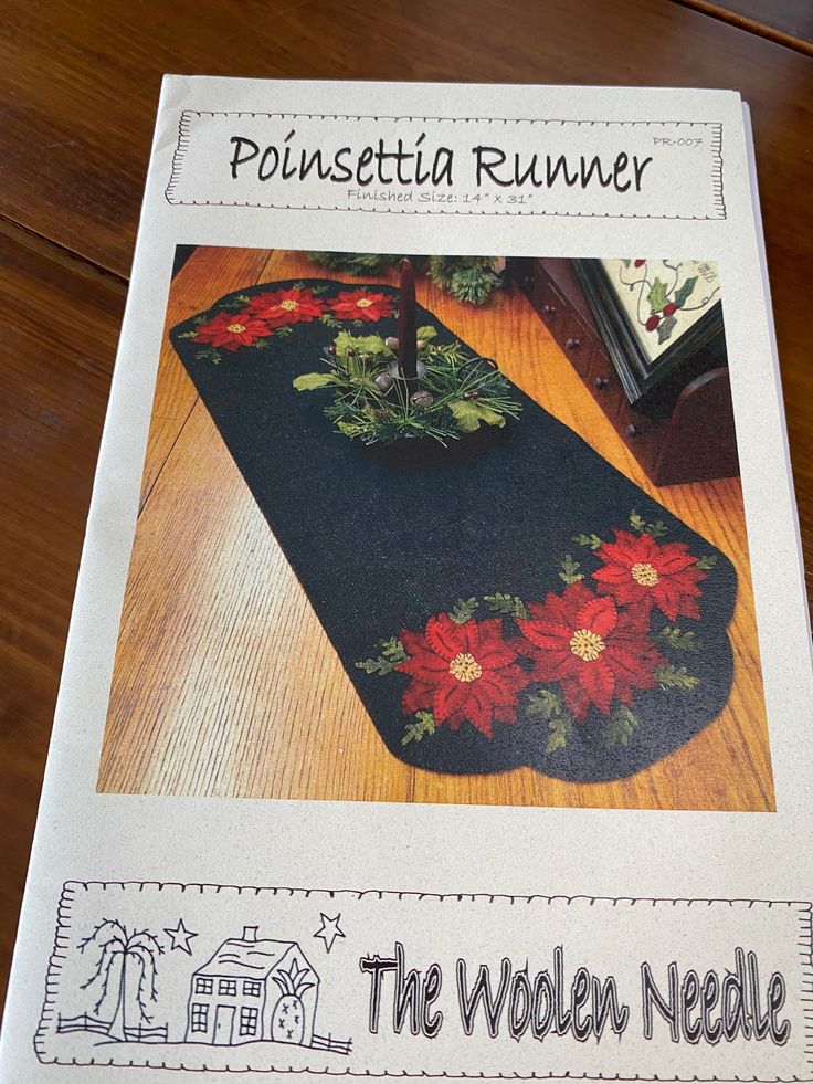 a book with an image of poinsettia runner on it