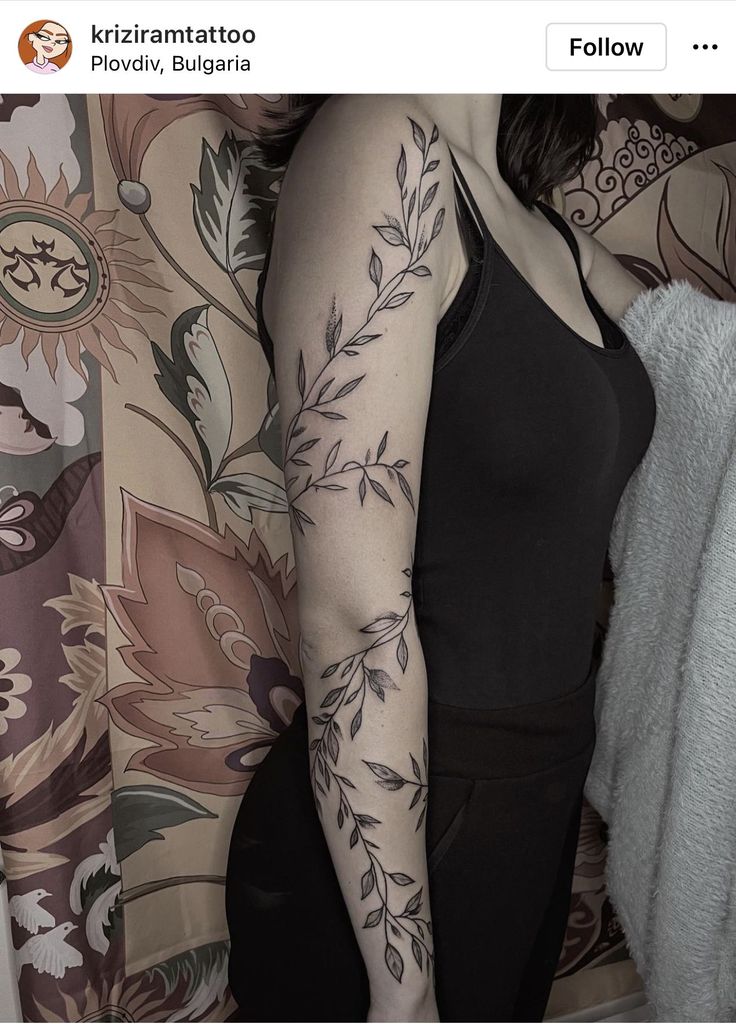 a woman with a tattoo on her arm