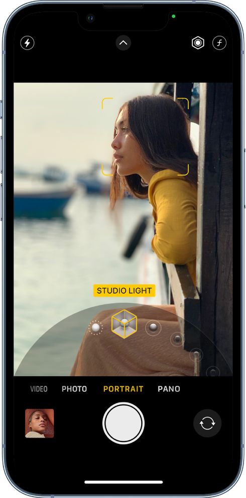 an image of a woman looking at the camera on her cell phone, with text reading studio light video portrait pano