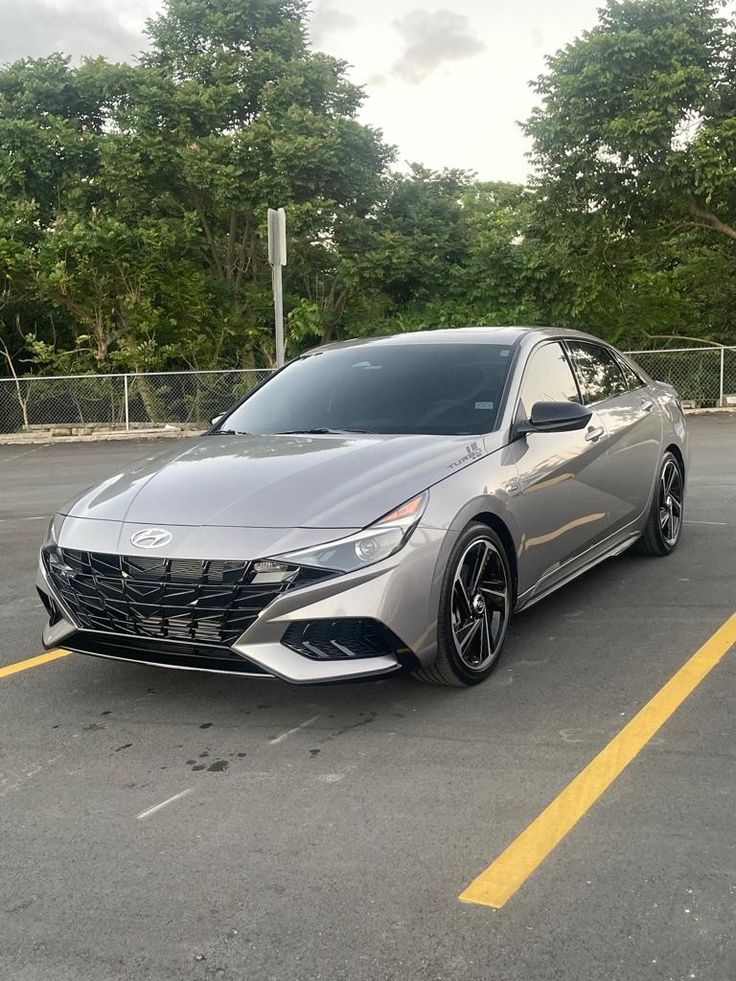 a silver car parked in a parking lot