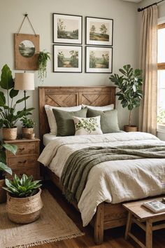 a bed sitting in a bedroom next to a window with potted plants on it