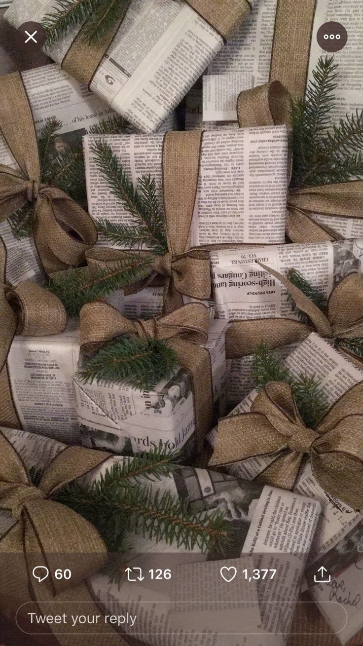 some books wrapped in burlocks and tied with twine bows are stacked on top of each other