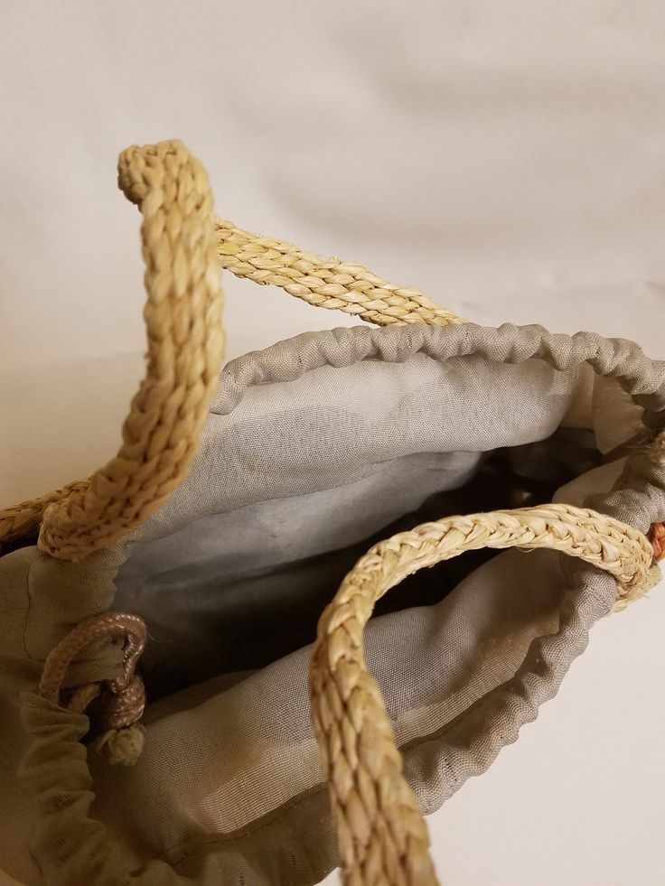 "Beautiful Rustic bag, please look at the pictures, color combination brown, copper, natural color, with pull cord closure, nice for Summer or any Season! Dimensions: 11\" x 6.5\" x 4\" Its a small cute bag. NO RETURNS, NO EXCHANGES, NO EXCEPTIONS! Please contact for any additional questions." Brown Straw Pouch Bag With Leather Handles, Brown Pouch Straw Bag With Leather Handles, Brown Pouch Bucket Bag For Vacation, Beige Pouch Shoulder Bag With Braided Handles, Handmade Brown Beach Bag As Gift, Handmade Brown Straw Pouch Bag, Brown Tote Beach Bag Gift, Brown Tote Beach Bag For Gift, Brown Beach Bag With Handles For Travel