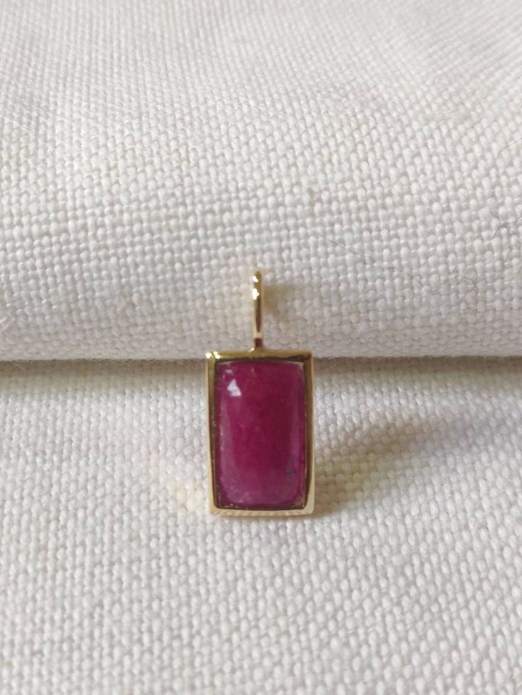 This stunning Pendant is set in 14k Solid Yellow Gold with Natural Ruby with utmost precision. It is a unique gemstone Pendant for nearly every occasion and is completely hassle-free jewelry. ITEM DETAILS: *  GEM: Ruby * GEM SIZE: 7X13mm * GEM SHAPE: Octagon * Gem weight: 3.88 carats * Gold Purity: 14KT (58.33% approx.) * Gold Weight: 1.5 gram * Total Weight of the Pendant: 2.27 gram The Gold purity is guaranteed and it comes with authentic 14KT gold hallmark. Since my items are handmade, they a Elegant Jewelry With Bezel Setting Rectangular Pendant, Fine Jewelry With Rectangular Gemstone Accents, 14k Gold Gemstones For Jewelry Making, Fine Jewelry With Gemstone Accents Rectangular Shape, Fine Jewelry In Yellow Gold With Ruby, Fine Jewelry Ruby In Yellow Gold, Elegant Jewelry With Square Pendant Natural Stones, Elegant Jewelry With Rectangular Pendant And Natural Stones, Elegant Square Pendant Jewelry With Natural Stones