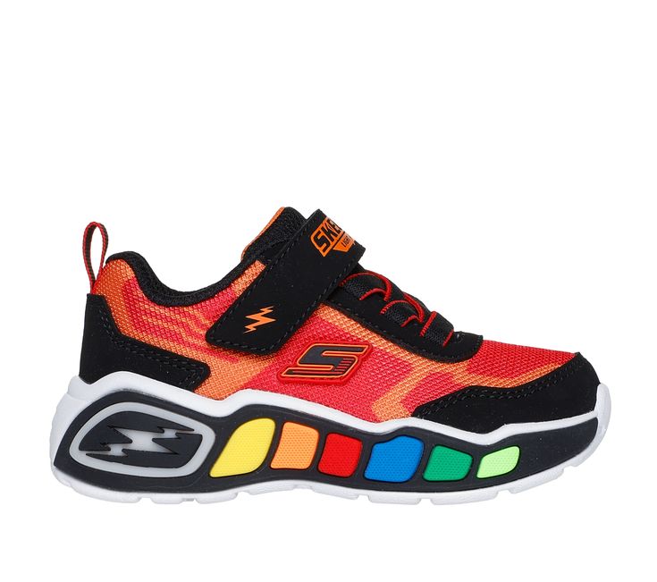 Be the fun in colorful light-up style wearing Skechers Play Scene - Storm Brights. This sporty light-up design features a mesh and synthetic upper with stretch laces, adjustable instep strap, cushioned comfort insole, and a multi-colored light-up midsole tech piece. | Skechers Boy's Play Scene - Storm Brights Sneaker | Medium Width | Lightweight light-up midsole | Skechers easy on, easy off adaptive closure for a customized fit | Cushioned comfort insole | Mesh and synthetic upper with stretch laces and adjustable instep strap | Shock-absorbing cushioned midsole with multi-colored light-up tech piece | Flexible traction outsole | Skechers Multicolor Running Shoes For Light Sports, Multicolor Nylon Sneakers For Sports, Multicolor Sneakers With Translucent Outsole For Light Sports, Multicolor Sports Running Shoes With Elastic Laces, Multicolor Mesh Running Shoes For Training, Multicolor Synthetic Sneakers For Training, Multicolor Running Shoes With Elastic Laces For Sports, Multicolor Sneakers With Elastic Laces For Sports, Multicolor Running Shoes With Translucent Outsole For Sports