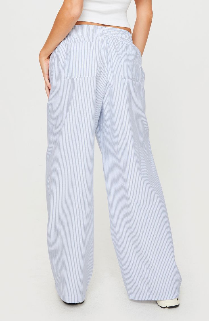 Lounge comfortably in wide-leg pants cut from a crisp and breezy cotton blend in classically cool stripes. Elastic waist Back patch pockets 65% cotton, 35% polyester Machine wash, tumble dry Imported Stripe Pants, Rollerball Perfume, Walker Shoes, Blue Fits, Platform Slippers, Maternity Shops, Designer Clothes For Men, Toddler Girl Outfits, Kids Sneakers