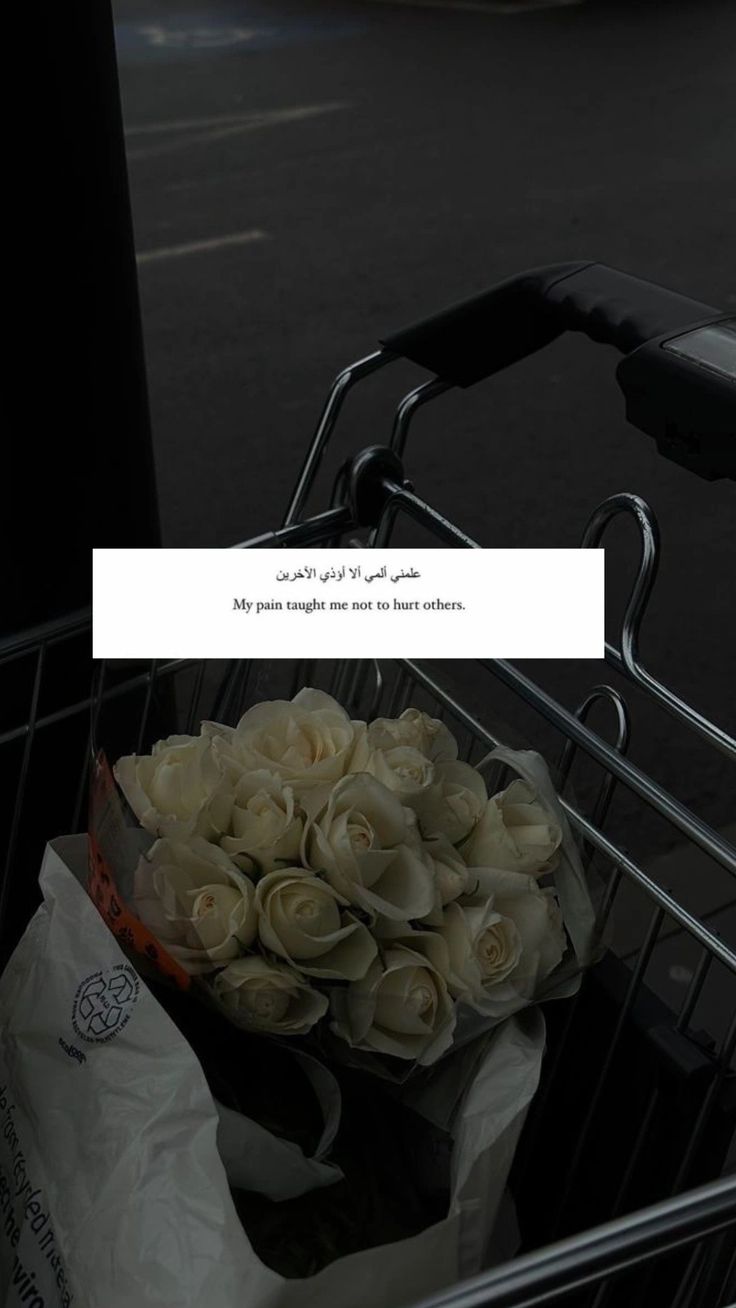 a shopping cart filled with lots of white flowers