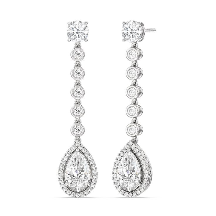 The teardrop-shaped diamonds are the centerpiece of these earrings. Their graceful shape adds movement and flow to the design, creating a captivating and elegant look. Diamond White Pear-shaped Teardrop Earrings, White Pear-shaped Teardrop Earrings With Diamond Accents, Elegant White Gold Pear-shaped Chandelier Earrings, Luxury Pear-shaped Diamond White Chandelier Earrings, White Pear-shaped Chandelier Earrings In Fine Jewelry, Blue Wedding Band, Dangler Earrings, Something Blue Wedding, Gorgeous Engagement Ring