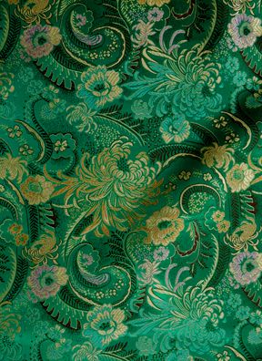 green and gold paisley print fabric with metallic foil on the bottom, in an ornate pattern