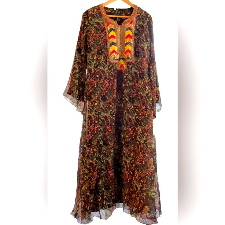 Long Maxi Dress Brown Red Black Tan Floral Print Maxi Length /Maxi Dress Kurta Sequence Designed Front Neck Collar Pattern Of Red Gold Brown Yellow Red Blue Sequences . Along With Brown Beaded Detail 23 Inch Bell Sleeves 21 Inches Armpit To Armpit 56 Inches Shoulder To Hem Modern / Hippie / Boho / Calypso / Resort/ Beach/ Island /Anthropologie/Vintage/ Grandma’s Shift’s/ Summer Bohemian Georgette Kurta, Bohemian Georgette Kurta For Summer, Silk Maxi Kurta With Floral Print, Silk Kurta With Floral Print In Maxi Length, Bohemian Georgette Kaftan With Floral Print, Bohemian Floor-length Kurta For Festive Occasions, Bohemian Floor-length Festive Kurta, Bohemian Silk Kurta For Festive Occasions, Traditional Multicolor Georgette Kaftan