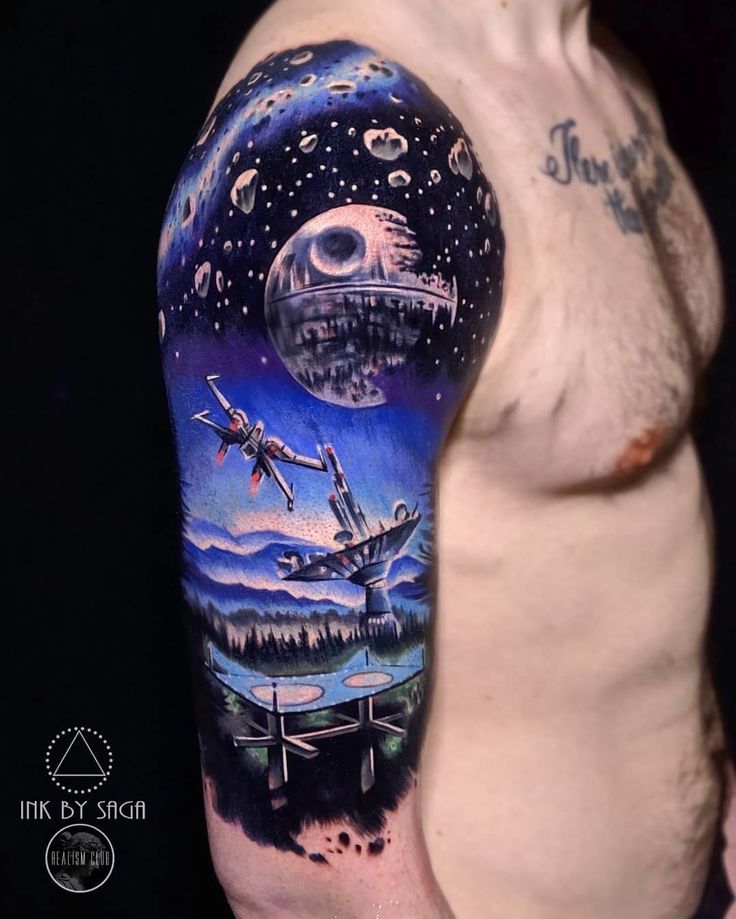 a man with a tattoo on his arm that has an image of spaceships flying in the sky