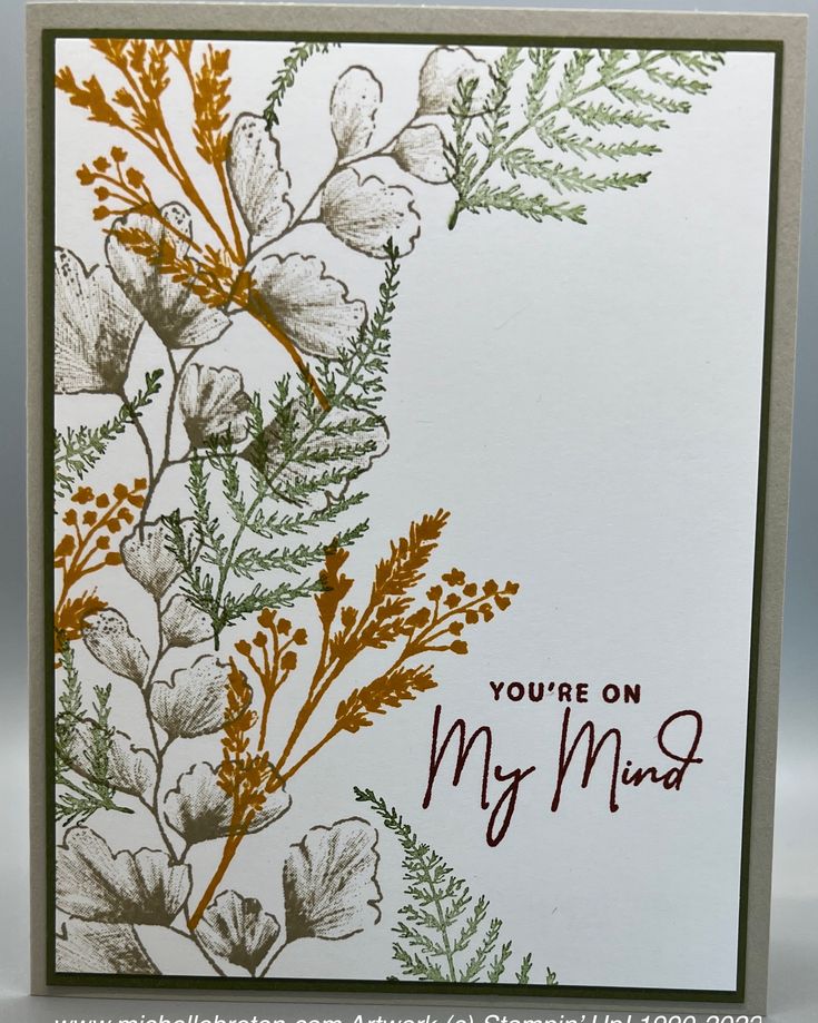 a close up of a card with flowers on it