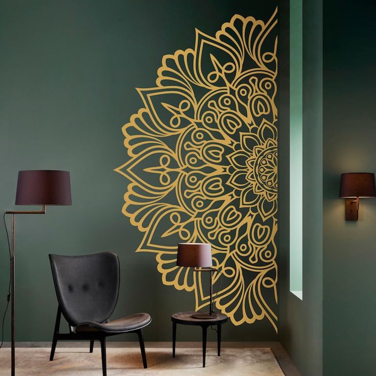 a room with two chairs and a wall decorated with an intricately designed flower design