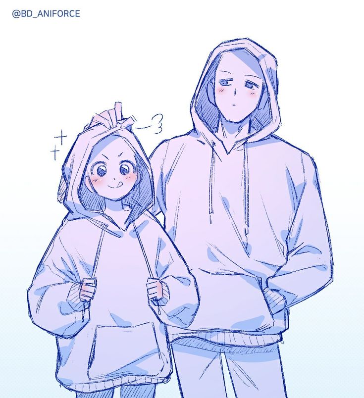 two people standing next to each other wearing hoodies