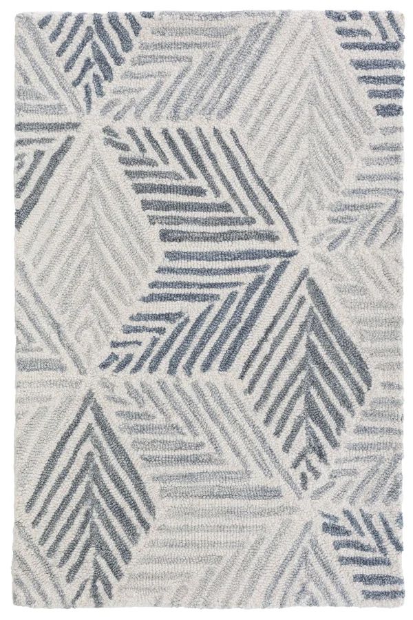 an area rug with blue and white designs on the side, in various shades of grey