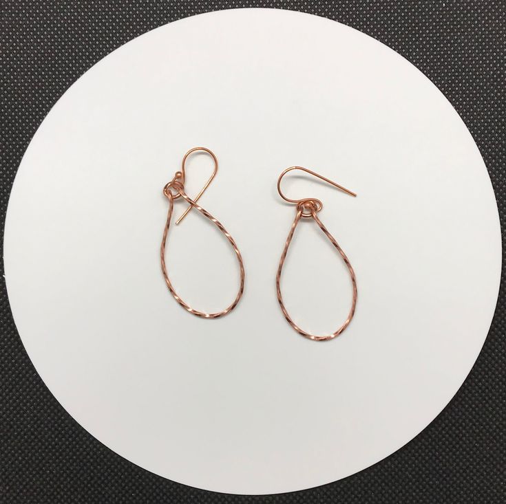 Shiny, lightweight twisted copper teardrop earrings.Approximately 1 1/2" long and 7/8" wideThese earrings have been polished and sealed. Sealed with Protectaclear ProtectaClear is a clear, protective coating that is tough enough to protect jewelry and is safe for wear against skin. ProtectaClear is practically invisible once applied and will seal and protect jewelry from tarnish, oxidation, and corrosion Silver Teardrop Jewelry With Copper Wire, Silver Teardrop Jewelry In Copper Wire, Elegant Teardrop Copper Wire Earrings, Wire Wrapped Copper Teardrop Earrings, Copper Wire Teardrop Earrings, Teardrop Wrap Earrings As Gift, Teardrop Wrap Earrings For Gift, Rose Gold Teardrop Earrings Gift, Nickel-free Copper Wire Teardrop Earrings