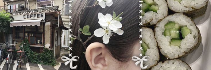 a woman with flowers in her hair is looking at sushi rolls on the street