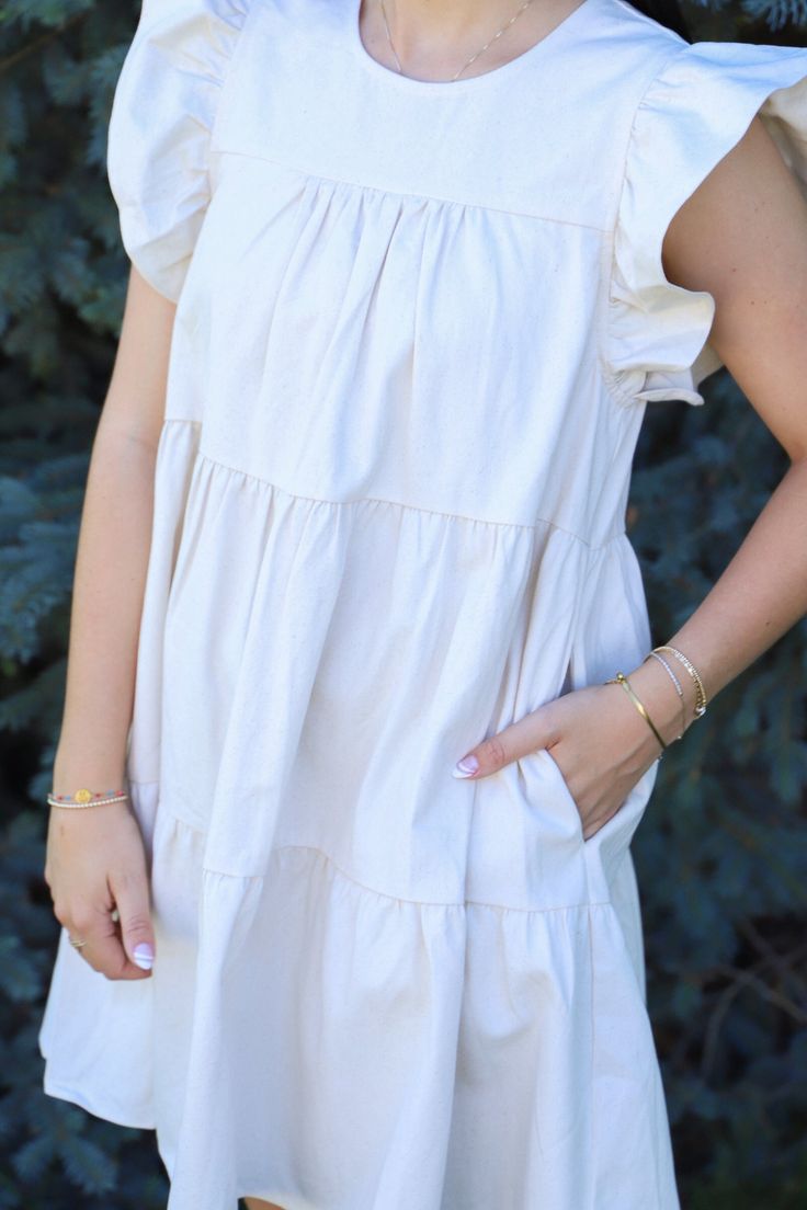 This dress could not be more perfect for summer. We love a neutral dress around here that pairs with absolutely everything! You would not believe the quality of this dress. I wish you could reach through the screen and feel it right now. Just take my word for it. Unreal ruffle sleeves with the cutest tiers AND pockets. Running true to size. Malorie is 5'6" and wearing a size medium. Neutral Dress, Head In The Clouds, Trend Report, In The Clouds, Ruffle Sleeves, Feel It, 50's Dress, The Clouds, Love A