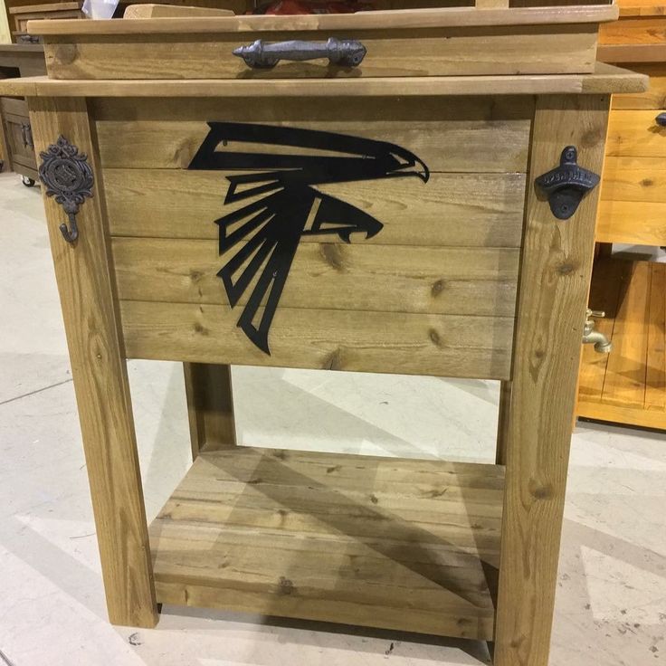 a wooden table with an eagle painted on it