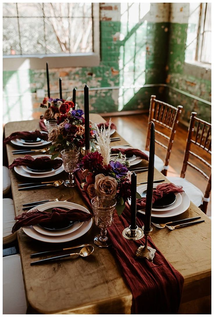 the table is set with place settings for dinner