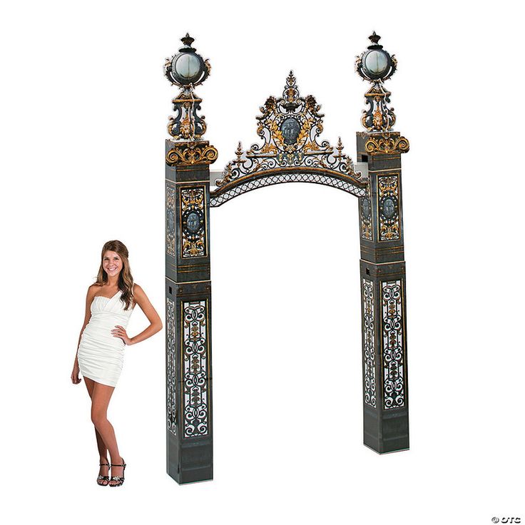 a woman standing in front of an ornate archway