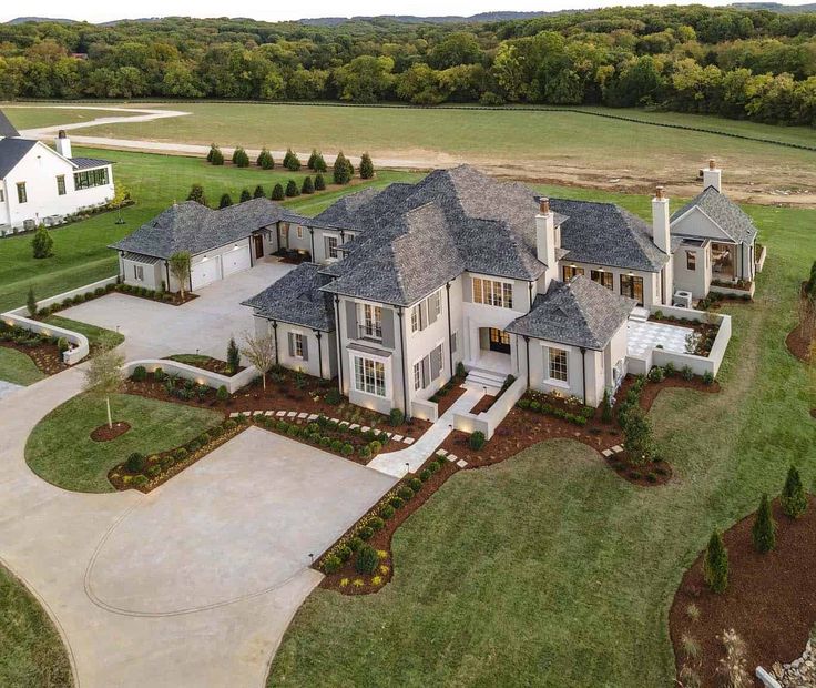 an aerial view of a large home in the country