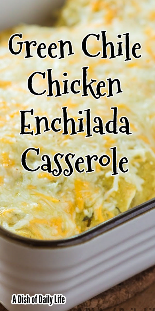 green chile chicken enchilada casserole in a white dish on a wooden table